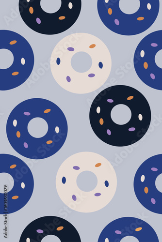 Colorful donuts scattered on a light blue background food sweet