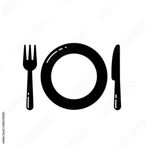 Cutlery set with fork and knife beside a round plate  