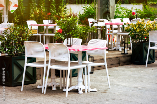 Photography Chairs and tables. Abandoned sidewalk cafe autumn morning