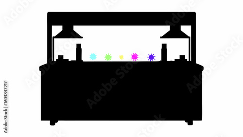 Silhouette of serving station with food warmers and colorful star shaped objects on top of the counter