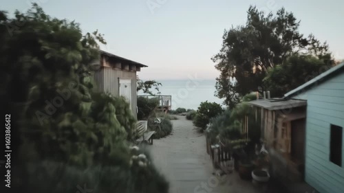 Wallpaper Mural Coastal Retreat: A Glimpse of Tranquil Beach Houses at Sunset, wooden houses near the sea Torontodigital.ca