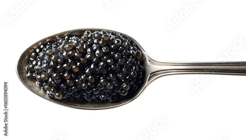 Dark caviar atop a silver spoon