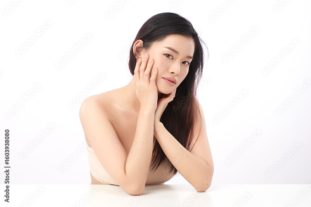 A beautiful young Asian woman with clean, fresh skin against a white background. Skincare, facial treatment, cosmetology, beauty, and spa. An elegant portrait of an Asian woman. A beautiful young Asian woman with clean, fresh skin against a white background. Skincare, facial treatment, cosmetology, beauty, and spa. An elegant portrait of an Asian woman.