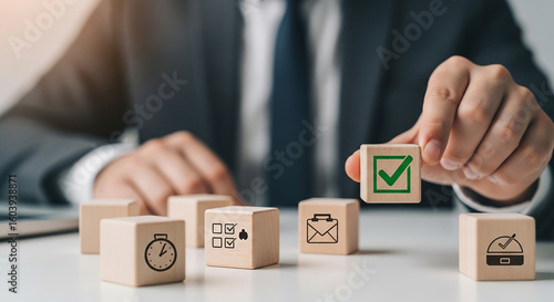Businessman placing cube with approval icon in row representing business decision project completion planning and productivity execution
