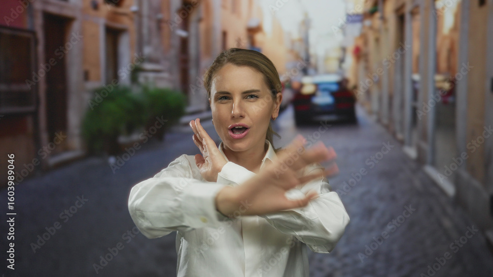 Fototapeta premium Woman smiling joyfully on city street with historic buildings in urban outdoor setting.