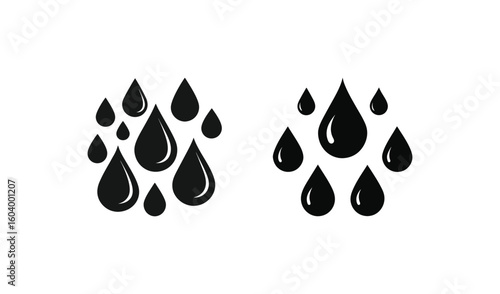 Black ink drops falling against a white background