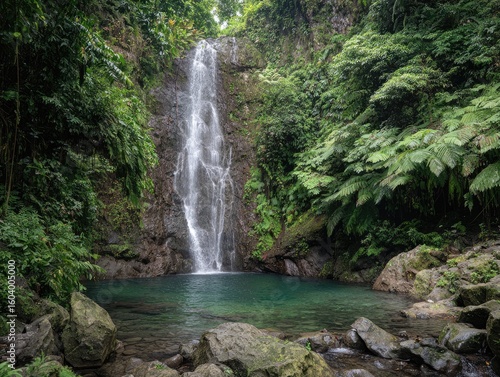 Lush waterfall cascading into a tranquil pool (1)