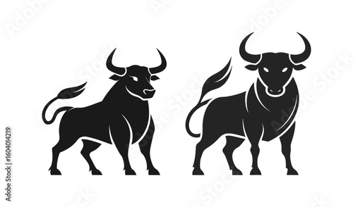 Two powerful black bulls silhouettes facing forward