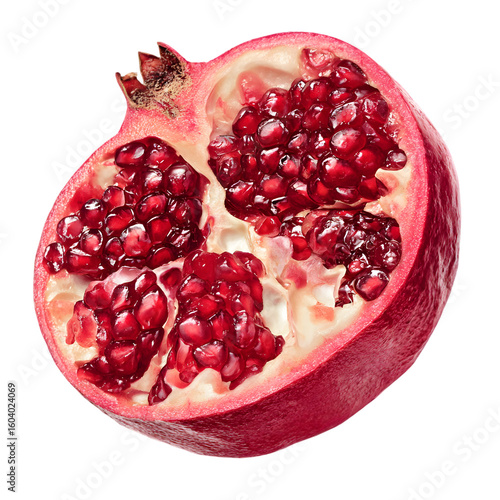 Close up of a ripe red pomegranate cut in half revealing juicy arils isolated on transparent background