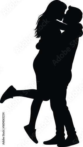 Silhouette of a Loving Couple Embracing and Kissing Man Lifting Woman in the Air