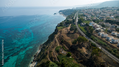 Railway, Cliffside Town, and Turquoise Sea – Aerial View of Coastal Landscape in Calabria, Italy