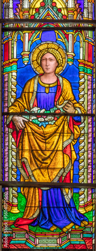 Perugia - The detail of stained glass with the St. Dorothy in the church Basi...