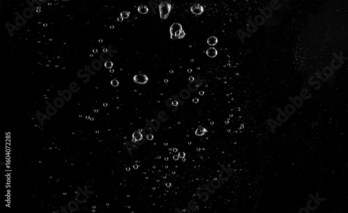 Underwater bubbles, Underwater oxygen design concept, Small water drops underwater, On black background, Close-up photography.