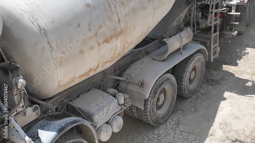 Concrete mixer truck spinning at a construction site