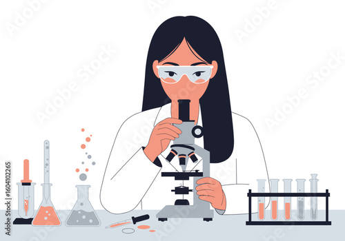 A scientist with goggles looks through a microscope surrounded by lab equipment on a white surface