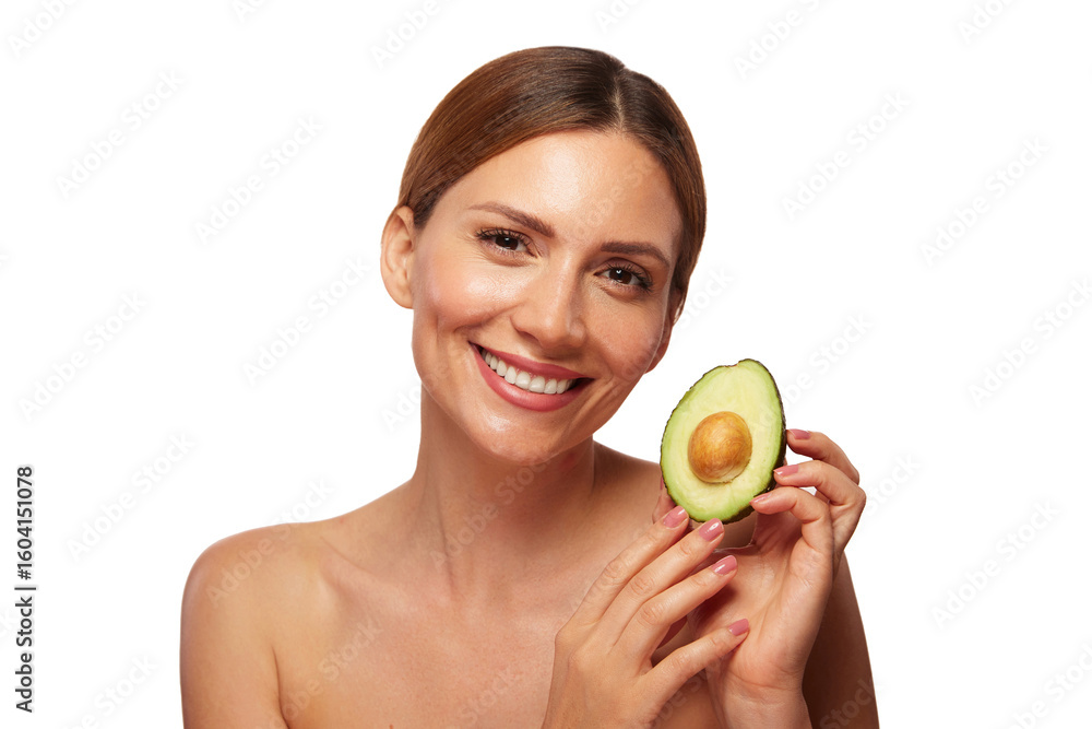 A woman showcases her radiant smile while holding a halved avocado, emphasizing its benefits for skin care and natural beauty. The setting is bright and minimalistic.