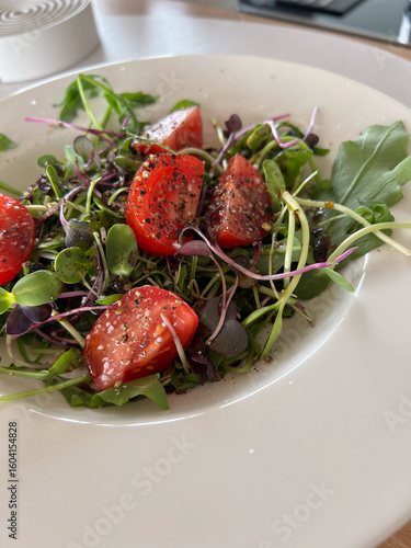 Close-Up of Fresh Tomatoes with Arugula and Garden Cress