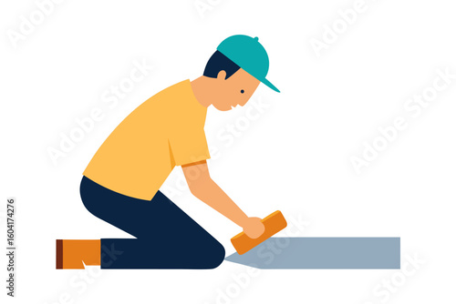 Craftsman kneeling and smoothing a surface with a tool