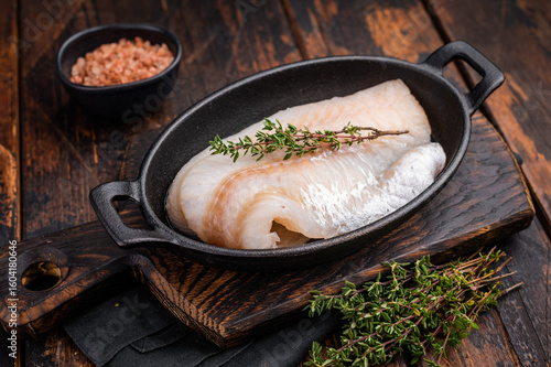 Fotografía Pristine raw cod fillet, waiting to be marinated and cooked to perfection for a delightful dining experience