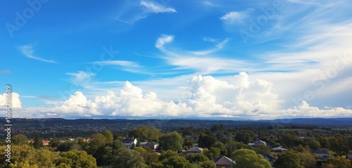 Cloudy Sydney sky over park; houses visible in distance, outdoor, building