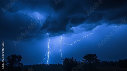 A dramatic lightning strike illuminates the dark stormy sky with electric blue brilliance.