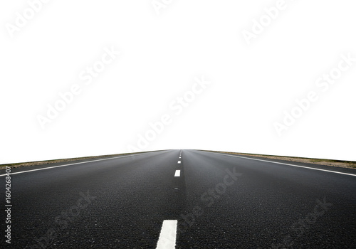 A long straight asphalt road with white lines stretches into the distance on a