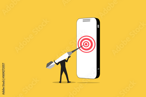 Businessman hitting Darts target on smartphone display. concept of success, achieving goals and in the direction and development of a company, startup or mobile App