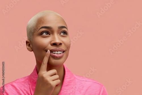 Woman with blonde buzz cut and pink robe image