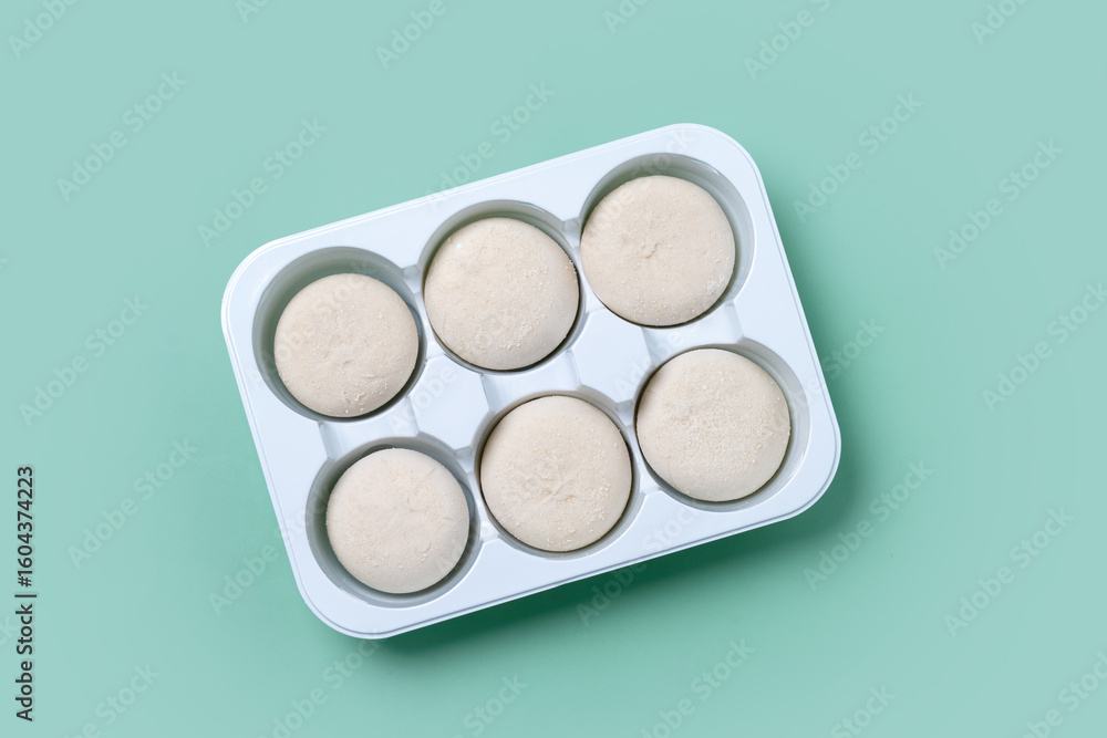 Japanese Cheesecake ice cream mochi on green background Japanese Cheesecake ice cream mochi on green background