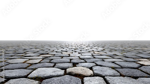 Stone path leading to a bright horizon with a reflective surface