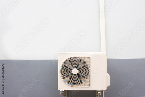 a heat pump on a house wall in the city