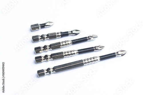 Many Head of screwdriver use of screwing or unscrewing a screw on white backgroundMany Head of screwdriver with silver screws on white background