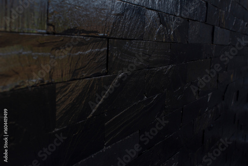 Horizontal vector illustration of dark black brick textured background. Suitable for use as wallpaper and design template. Simple and luxury design.
