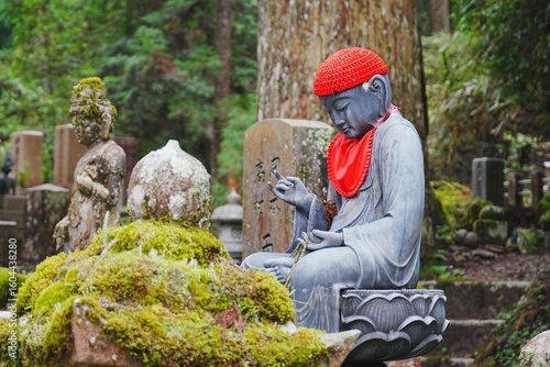 Canvas Print Buddha with red cap at Okunoin Cemetery in Koyasan, Japan