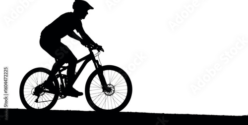 Silhouette cyclist in action: A dark silhouette of a cyclist in motion, riding a mountain bike with determination against the vast open sky, capturing the spirit of adventure and outdoor lifestyle.