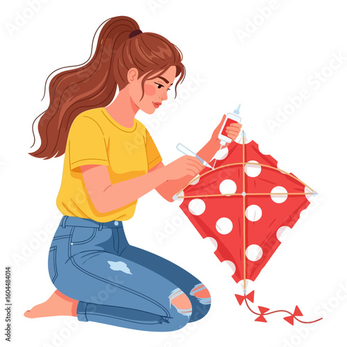 Woman Creating Red Polka Dot Kite While Kneeling Indoors Art Hobby