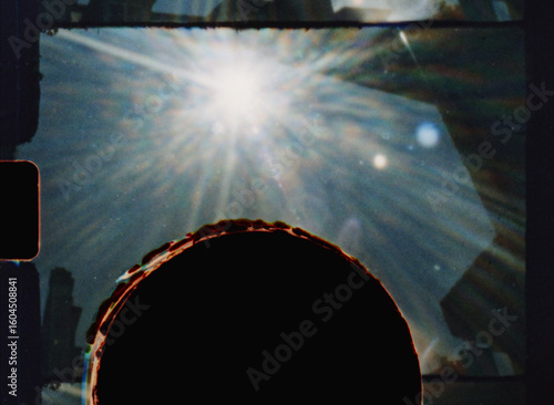 Super 8 film burn overlay creating a round damaged frame effect with light leaks