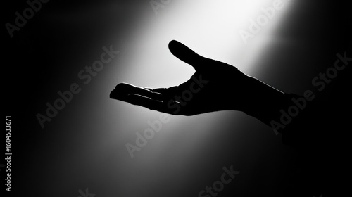Open hand in spotlight