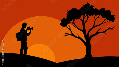 silhouette photographer holding camera