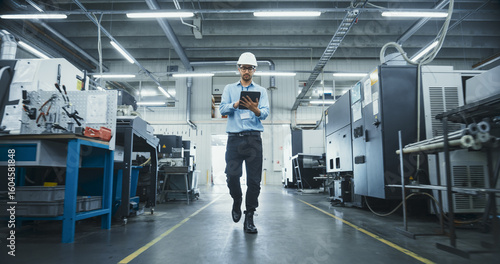 Wallpaper Mural Chief Technical Officer Working at Metal Components Production Factory. Young Middle Eastern Specialist Walking in the Facility, Using Tablet Computer to Monitor the Manufacturing Process Torontodigital.ca