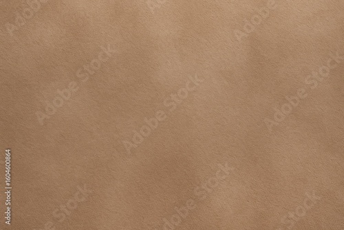 Detailed closeup of brown suede fabric texture used in clothing, upholstery, and accessories for fashion and design