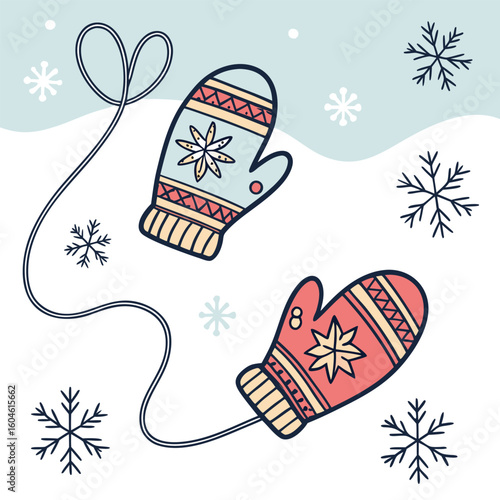 Cozy winter mittens with snowflakes and string