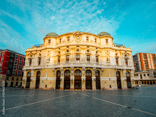 Majestic Arriaga Theatre bathed in golden light, a stunning architectural gem in Bilbao's historic Casco Viejo. Experience the grandeur of Spanish culture and timeless design.