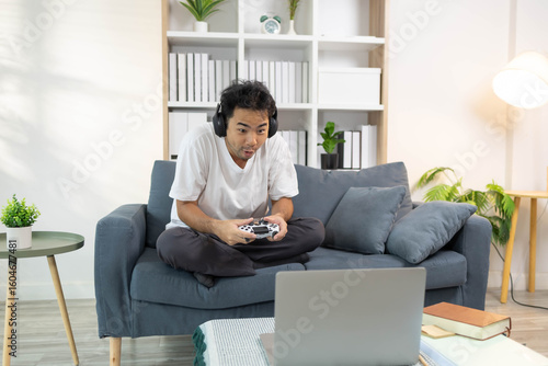 A man is playing video games on his laptop while sitting on a couch, having fun on his vacation.
Free Download A man is playing video games on his laptop while sitting on a couch, having fun on his vacation.
- GFXLoad