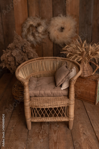Boho style. Retro wicker chair for photo shoot. Chair for child. Children's photo zone. Brown photo zone.