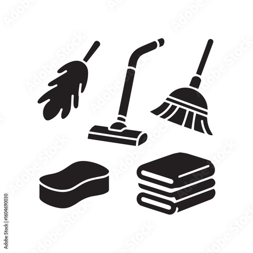 Collection of essential cleaning tools including a broom dustpan vacuum cleaner sponge and folded towels on a white background representing household chores and cleanliness