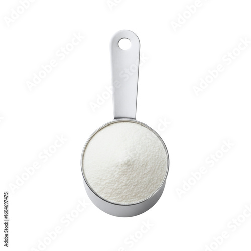 Fotografie Metal measuring cup filled with flour or powder
