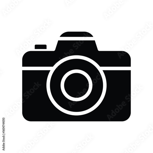 Black and White Icon of a Classic Camera with Lens and Simple Design