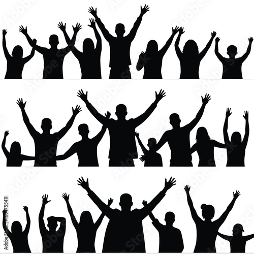 Silhouetted crowd celebrating with raised arms people celebration