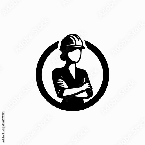 Confident female engineer in hard hat with arms crossed inside a circle.